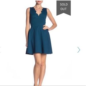 Scalloped v neck fit and flare dress